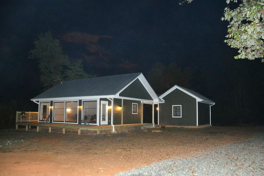 martins tiny house at night image